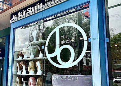 Front view of Jo Hair Studio Vancouver showcasing stylish wigs on display in Vancouver, British Columbia, CA.
