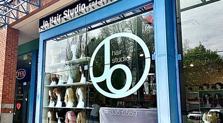 Front view of Jo Hair Studio Vancouver showcasing stylish wigs on display in Vancouver, British Columbia, CA.