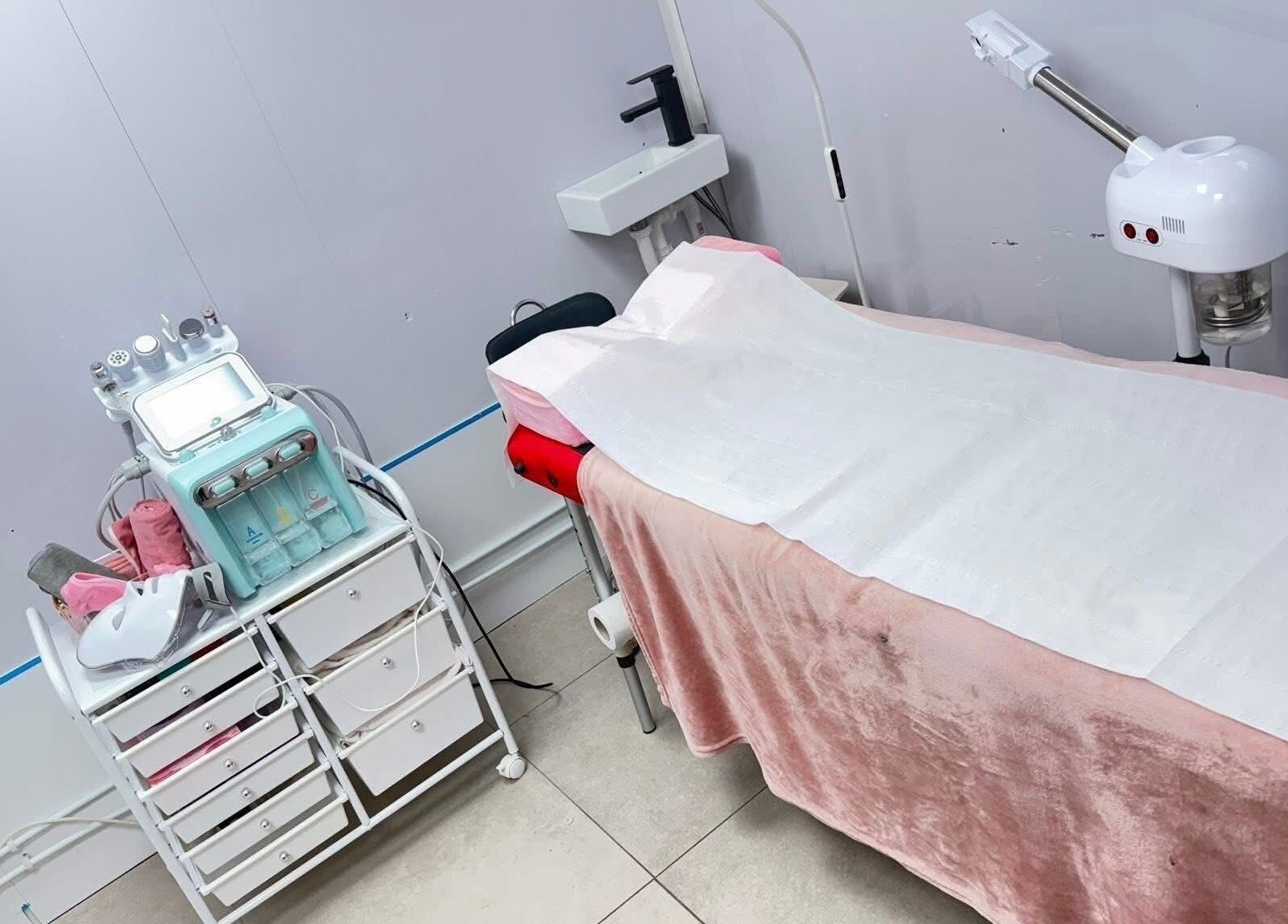 Luxurious spa room setup at Vees Vmc, Birmingham, England, GB with high-end equipment for facial treatments.