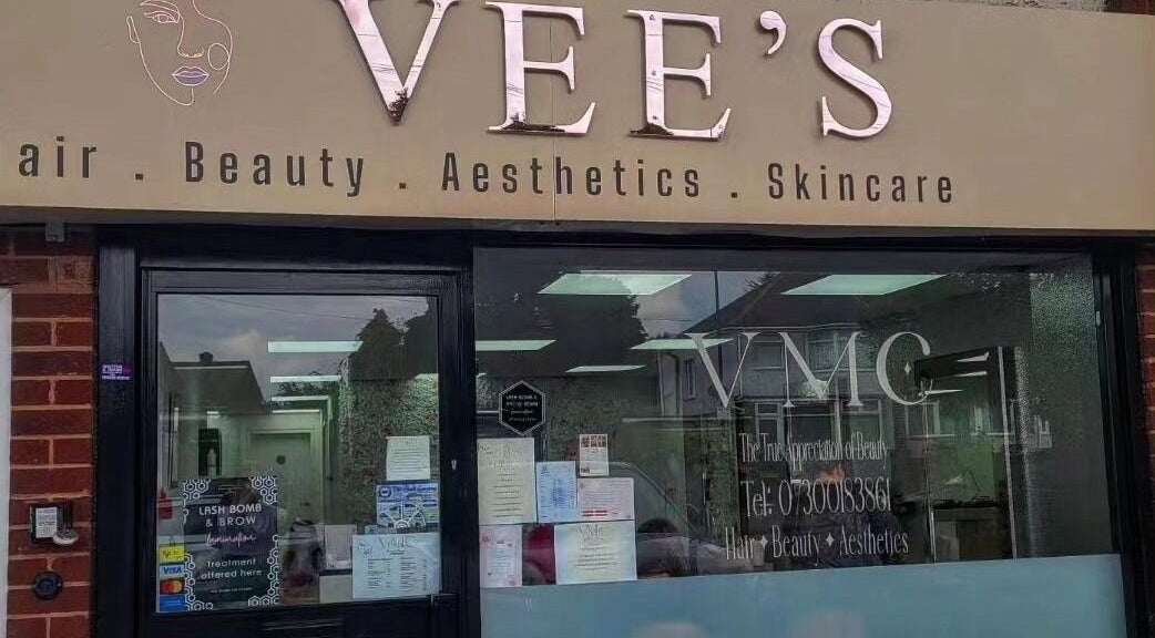 Vees Vmc in Birmingham, England, GB with elegant signage for hair and beauty services.