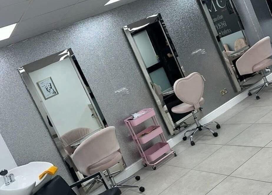 Elegant salon chairs and mirrors at Vees Vmc, Birmingham, England, GB. Modern beauty venue setup.