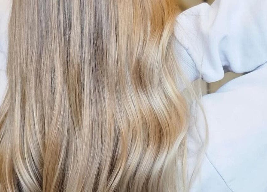 Flowing blonde hair styled at Phoenix Hair Design, Matraville, New South Wales, AU, showcasing expert hair styling.