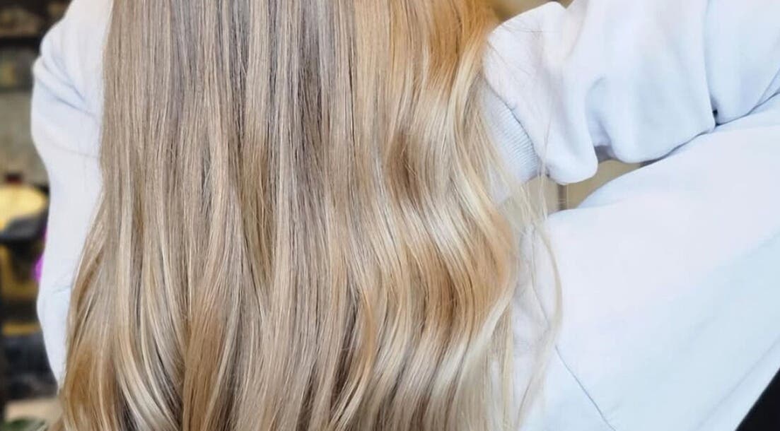 Flowing blonde hair styled at Phoenix Hair Design, Matraville, New South Wales, AU, showcasing expert hair styling.