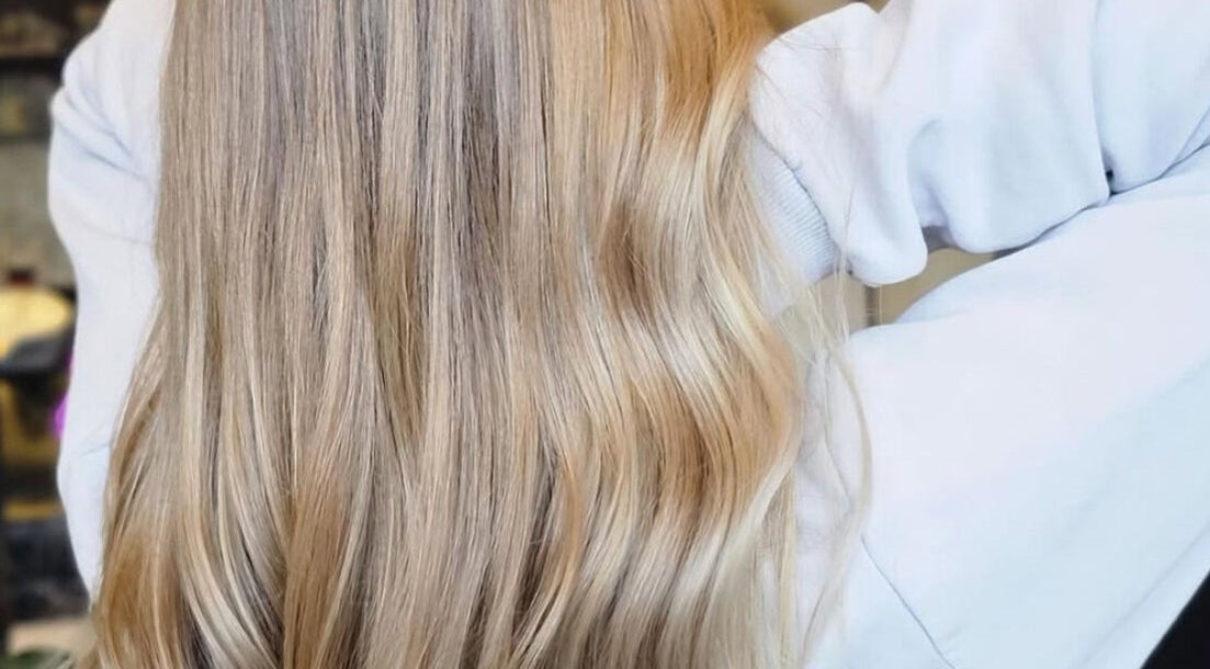 Flowing blonde hair styled at Phoenix Hair Design, Matraville, New South Wales, AU, showcasing expert hair styling.
