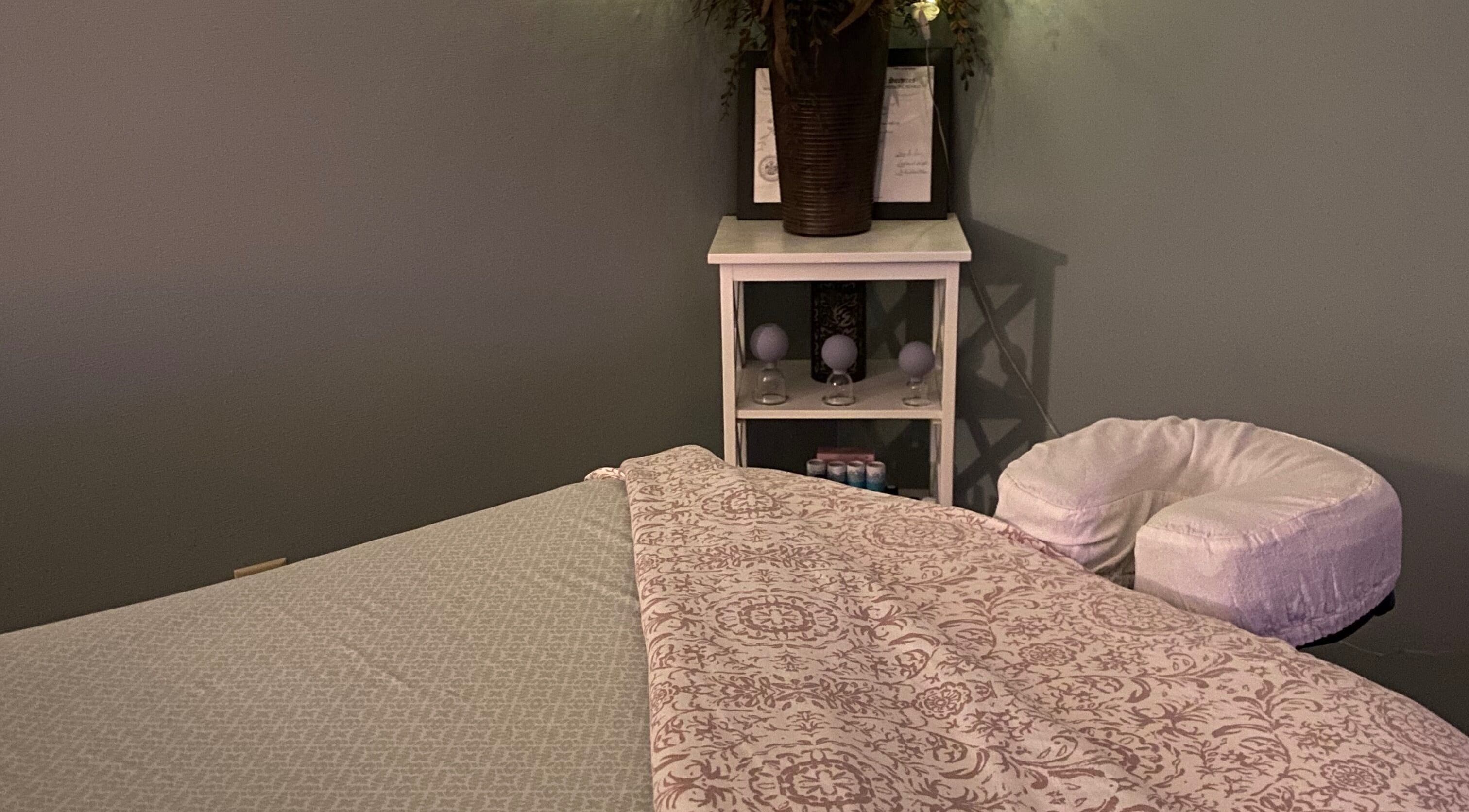 Serene massage room at Massage by Melissa, LLC in Wausau, Wisconsin, US, featuring a cozy table setting.
