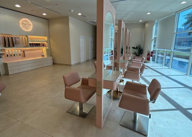 Spacious interior of Pose Salon in Dubai, Dubai, AE, featuring elegant styling stations and modern decor.