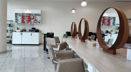 Stylish salon chairs and mirrors at Pose Salon, located in Dubai, Dubai, AE.