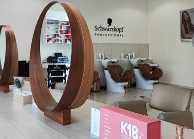 Elegant Pose Salon interior in Dubai, Dubai, AE with modern wooden mirrors and hair wash stations.