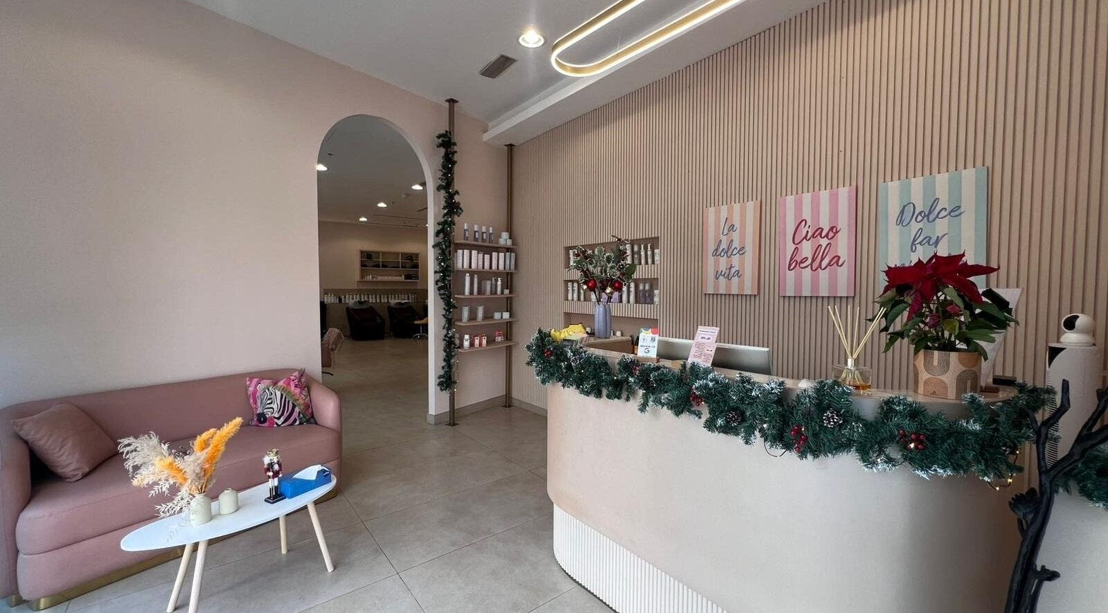 Welcoming reception at InHair Salon, Dubai, Dubai, AE with chic decor and cozy seating.