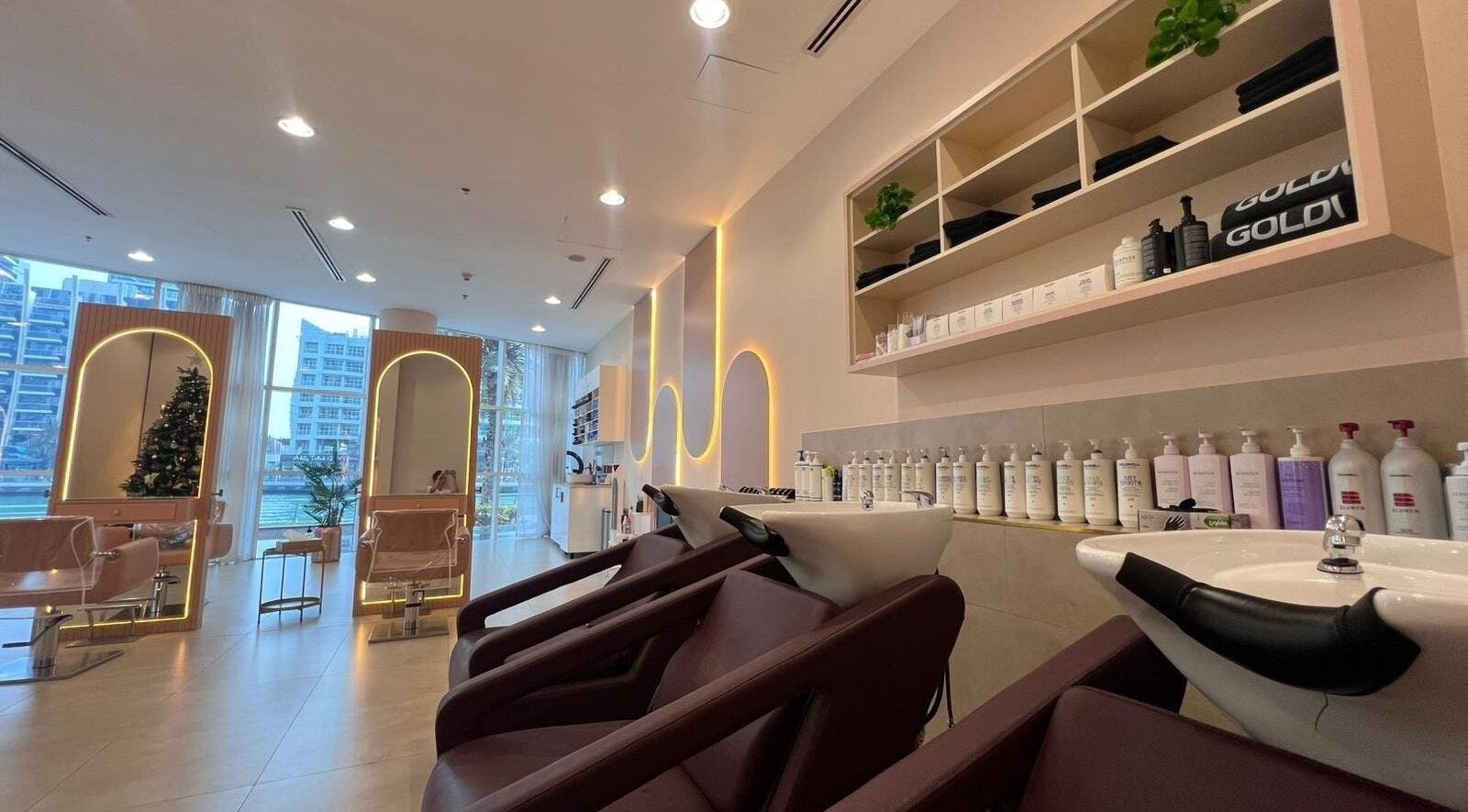 Modern InHair Salon in Dubai, Dubai, AE features elegant wash stations and bright, stylish design.