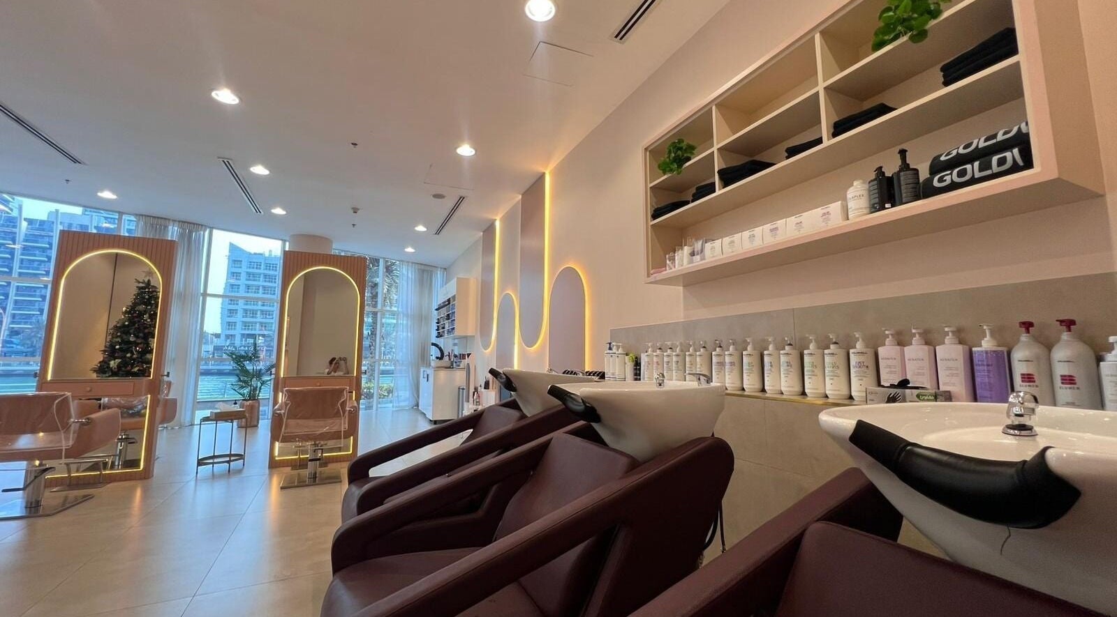 Modern InHair Salon in Dubai, Dubai, AE features elegant wash stations and bright, stylish design.