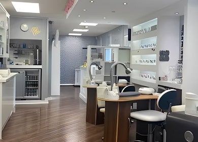 Bright salon interior at Revive in Rochdale, England, GB. Modern decor with sleek manicure stations.