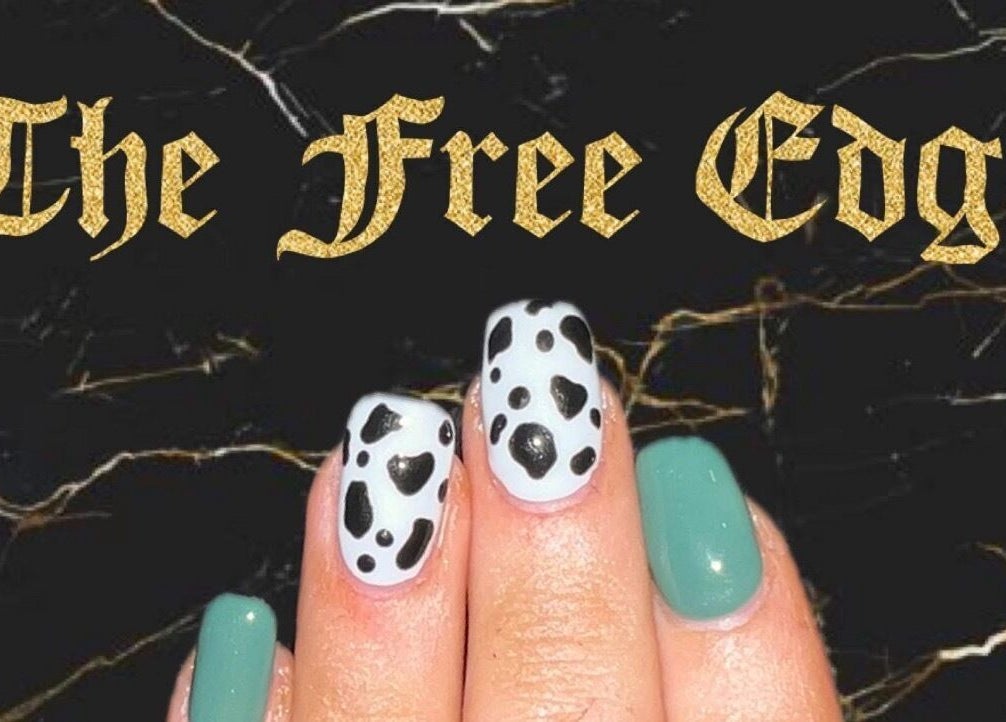 Stylish nail art at The Free Edge, Stornoway, Scotland, GB. Features black and aqua designs.