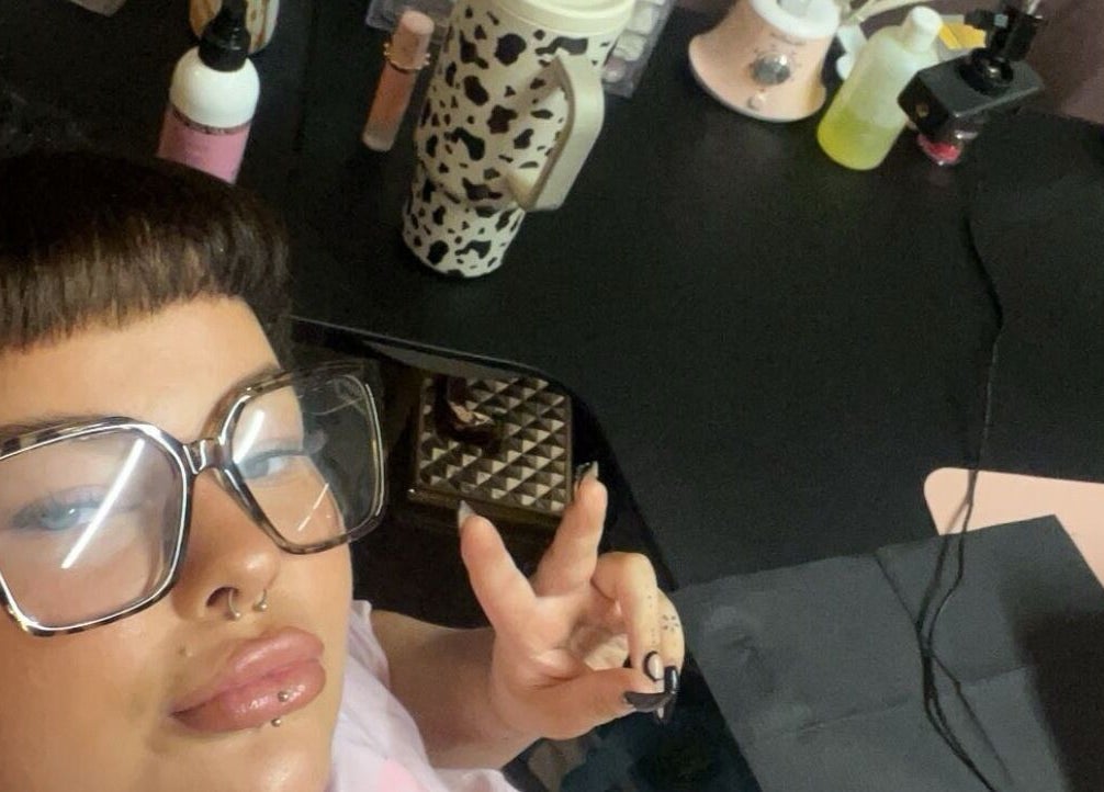 A person with stylish glasses at The Free Edge, a beauty venue in Stornoway, Scotland, GB.