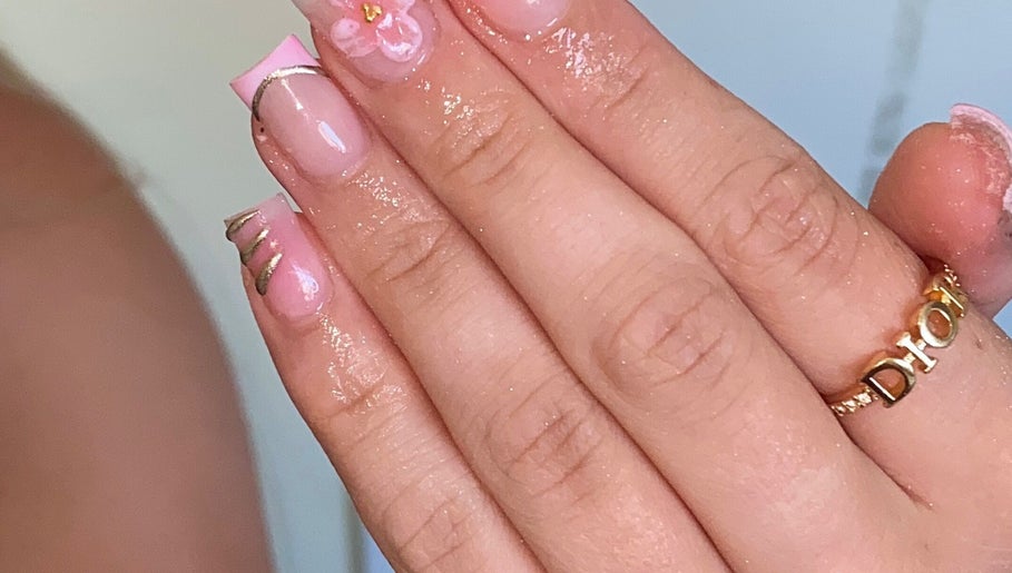 Elegant pink nail art with floral accents at Plugged.by.s, Margate, England, GB.