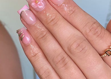 Elegant pink nail art with floral accents at Plugged.by.s, Margate, England, GB.