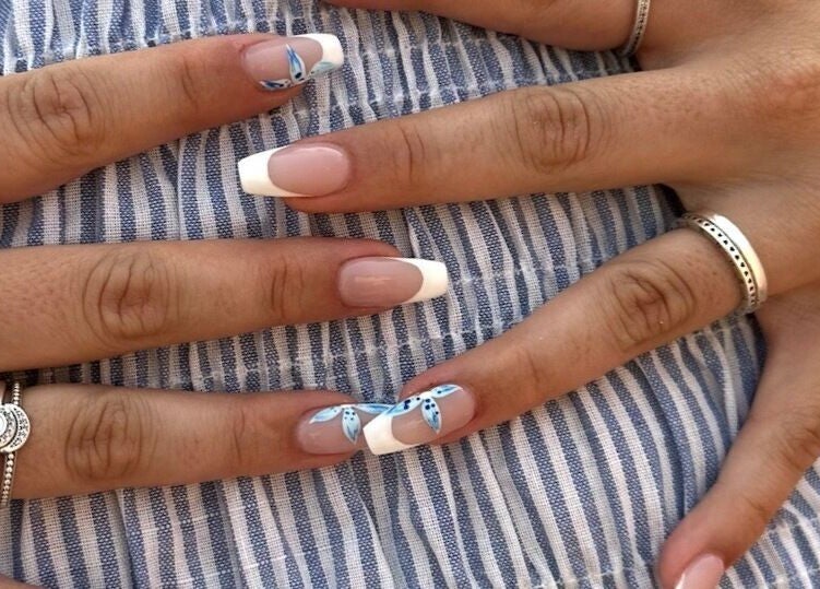 Elegant French manicure with floral accents by Nailed it by Nattareeya, Saint Helier, St Helier, JE.