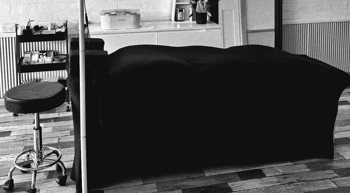 Cozy treatment room at Khai Beauty, Portland, NSW with a massage bed and wellness tools.