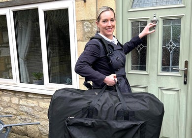 Therapist from Mobile Massage with Christie at door in England, England, GB with massage table.