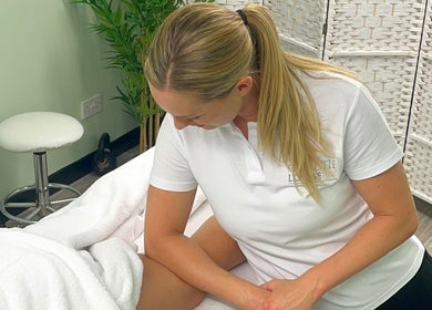 Therapist at Christie Louise Massage in Cirencester, England, GB provides a calming massage in a tranquil room.