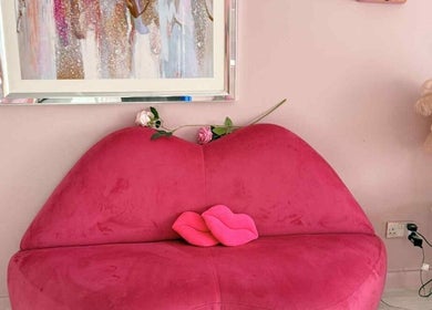 Stylish pink lip-shaped sofa at Platinum Empire, Newcastle upon Tyne, England, GB. Elegant decor enhances ambiance.