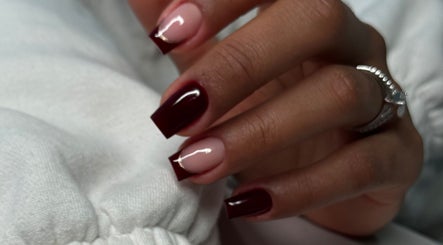 Stylishly manicured nails with burgundy polish at Studio Karla Horrana in Amsterdam, Noord-Holland, NL.