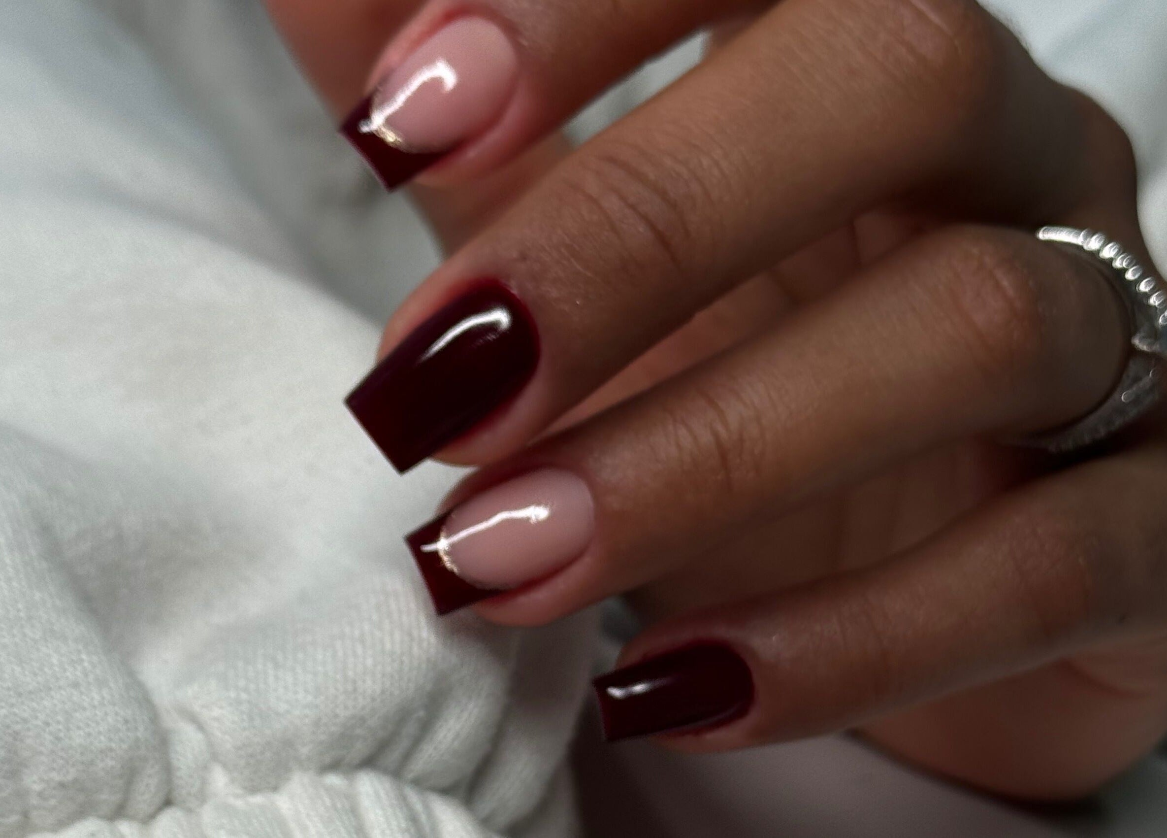 Close-up of elegant nail art in deep red at Studio Karla Horrana, Amsterdam, Noord-Holland, NL.