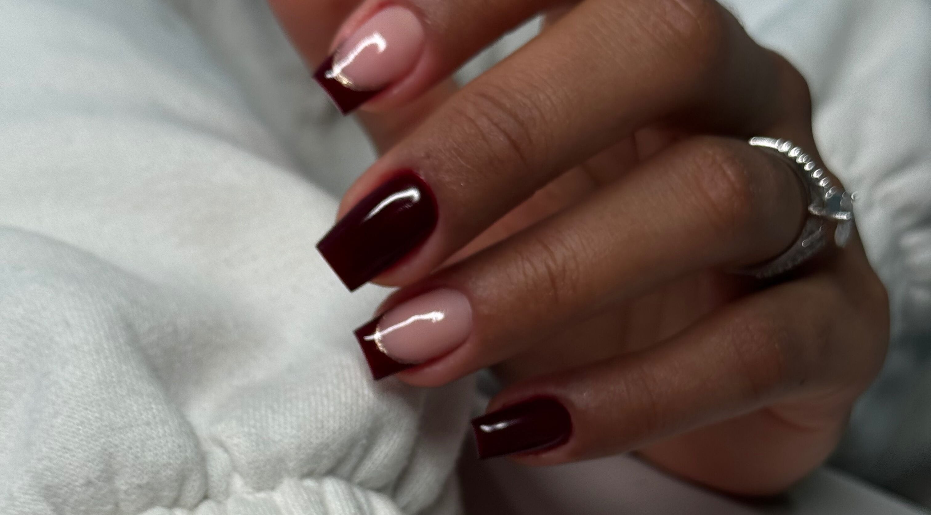 Close-up of elegant nail art in deep red at Studio Karla Horrana, Amsterdam, Noord-Holland, NL.