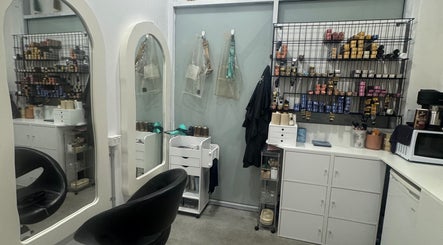 Isla hair's chic interior showcasing styling stations and supplies in Maroochydore, Queensland, AU.