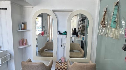 Chic hair styling station at Isla Hair, Maroochydore, Queensland, AU with elegant mirrors and salon chairs.