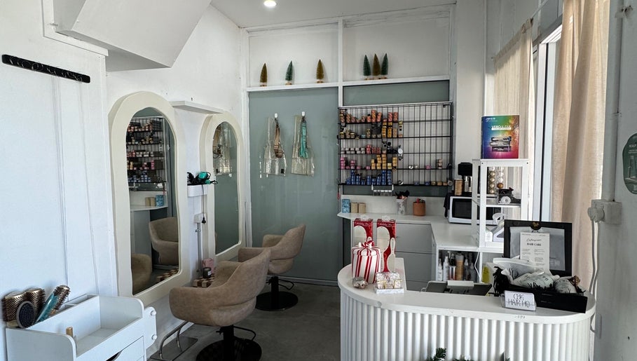 Modern interior of Isla Hair salon in Maroochydore, Queensland, AU showcasing styling stations and products.