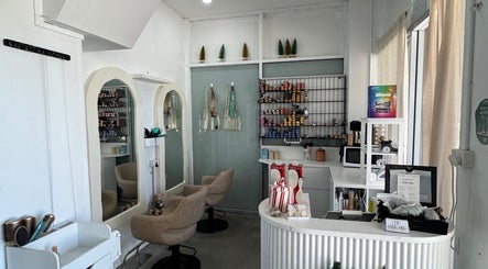 Modern interior of Isla Hair salon in Maroochydore, Queensland, AU showcasing styling stations and products.