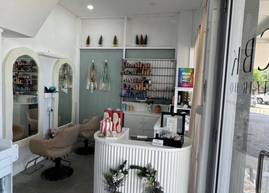 Cozy interior of Isla Hair salon in Maroochydore, Queensland, AU showcasing stylish decor and seating.