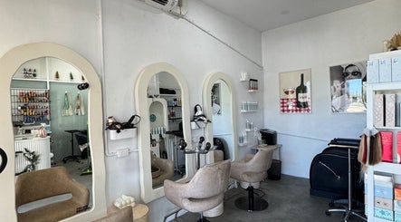 Styling chairs and mirrors at Isla Hair, Maroochydore, Queensland, AU showcasing modern salon interior design.