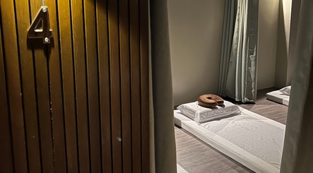Serene massage room at NUAT THAI Ortigas Extension (ORTEx), Cainta, Calabarzon, PH, showcasing minimalist design.