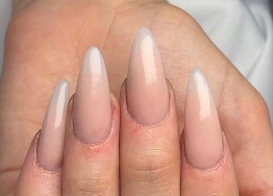 Elegant stiletto nails with a soft nude shade at Danischa Nails, Centurion, Gauteng, ZA.