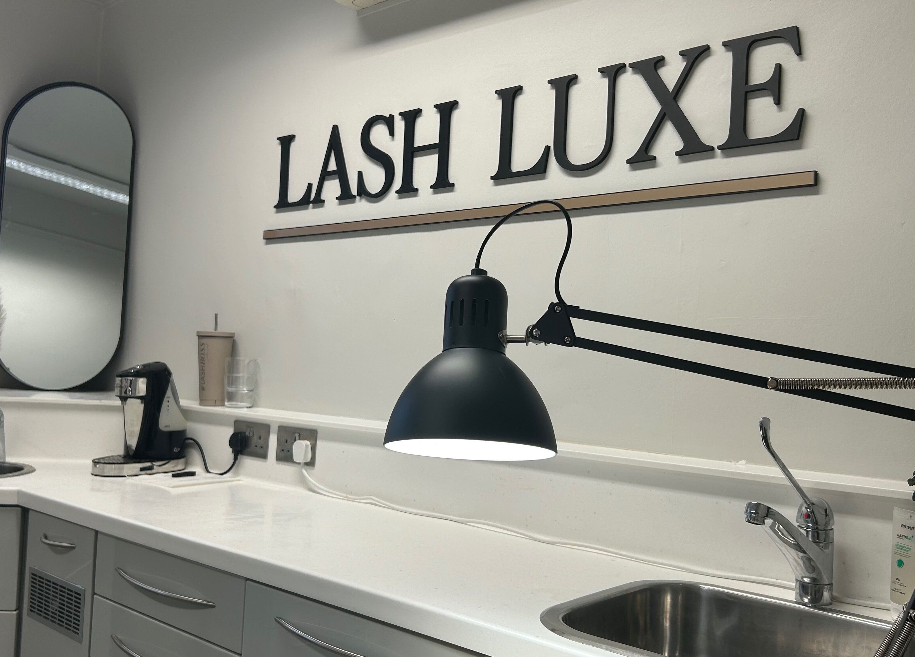 Modern workspace at Lash L'uxe & beauty, Peterborough, England, GB, featuring stylish decor and lighting.