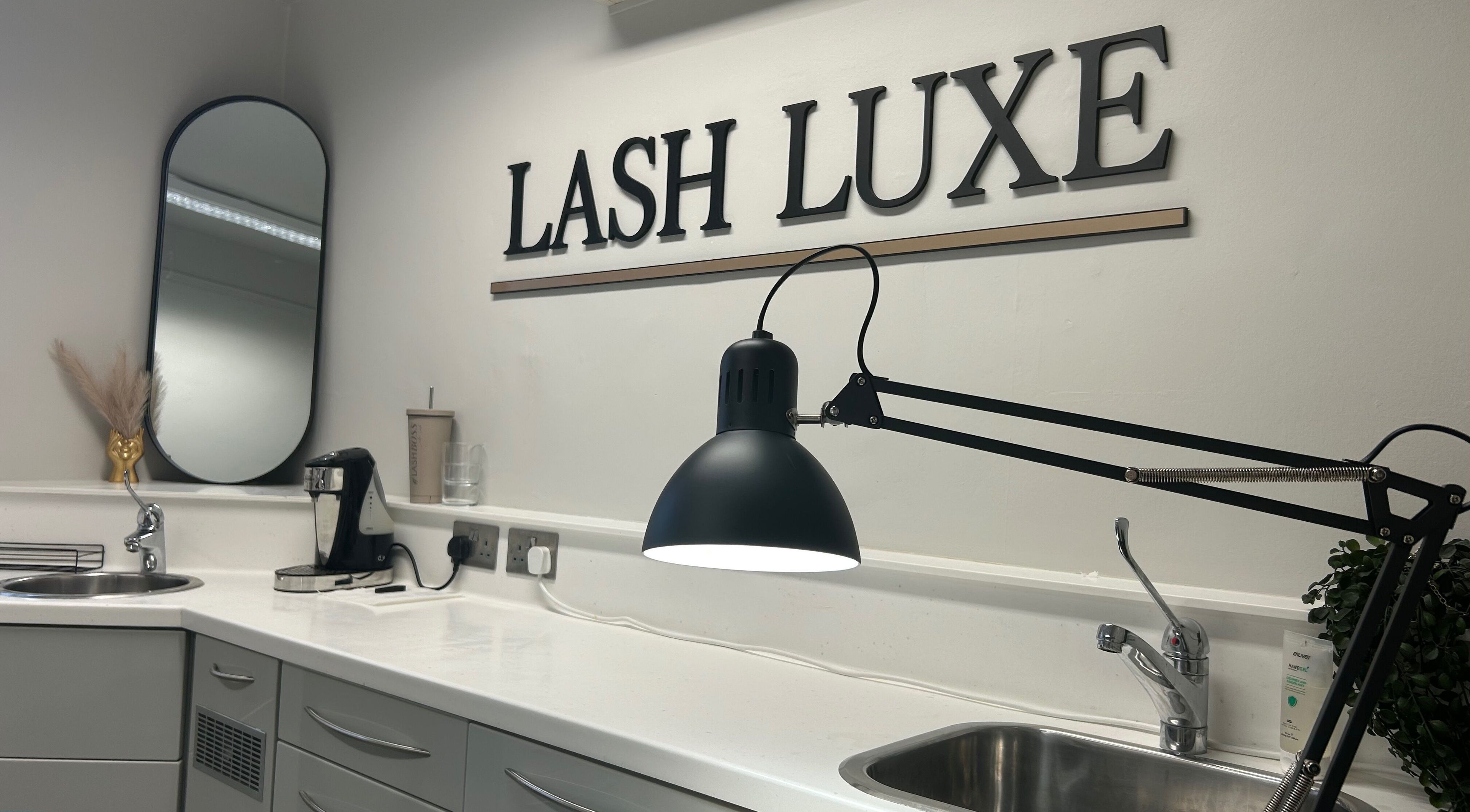 Modern workspace at Lash L'uxe & beauty, Peterborough, England, GB, featuring stylish decor and lighting.