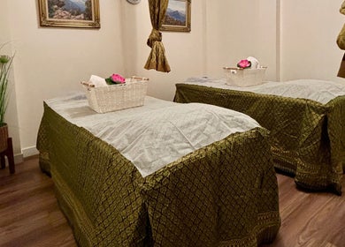 Relaxing spa room at Charm Thai Therapy, Melbourne, Victoria, AU with two massage beds in tranquil setting.