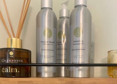 Massage oils and aroma diffuser on display at Grace & Glow, Maidstone, England, GB.