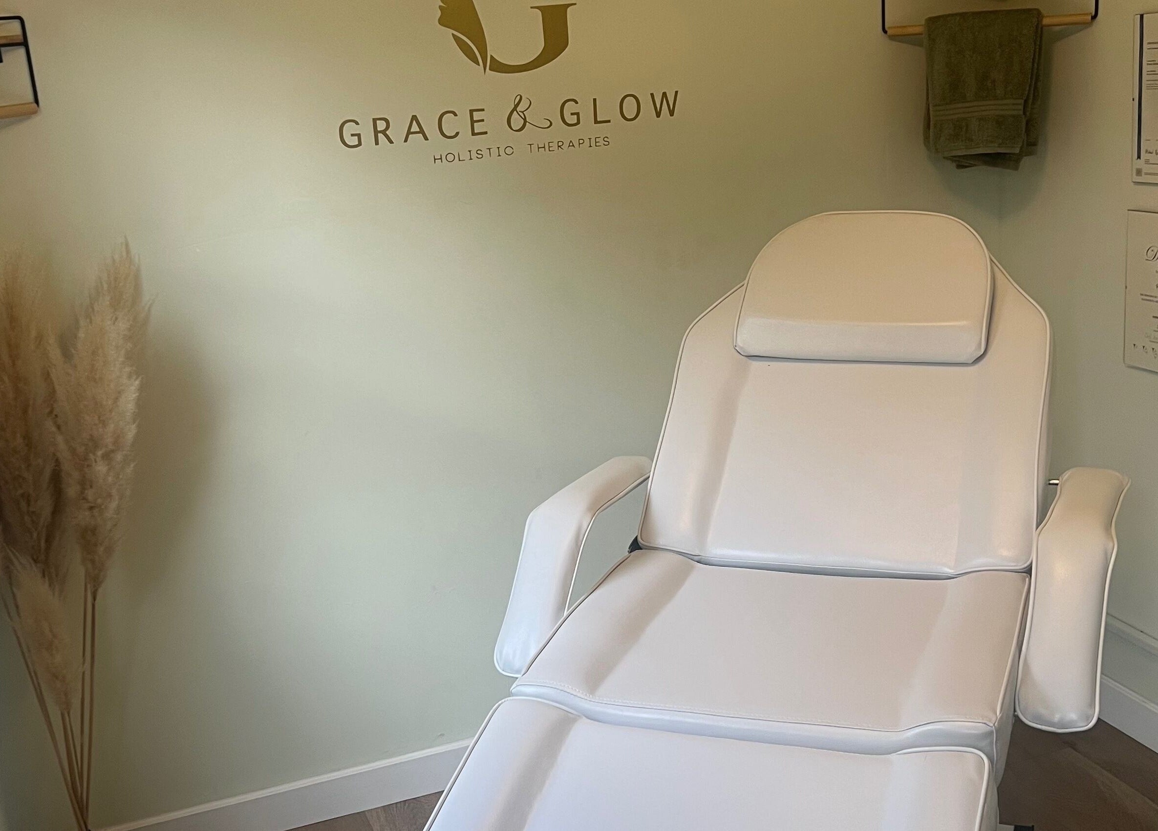 Elegant treatment room at Grace & Glow, Maidstone, England, GB, highlighting a plush white chair.