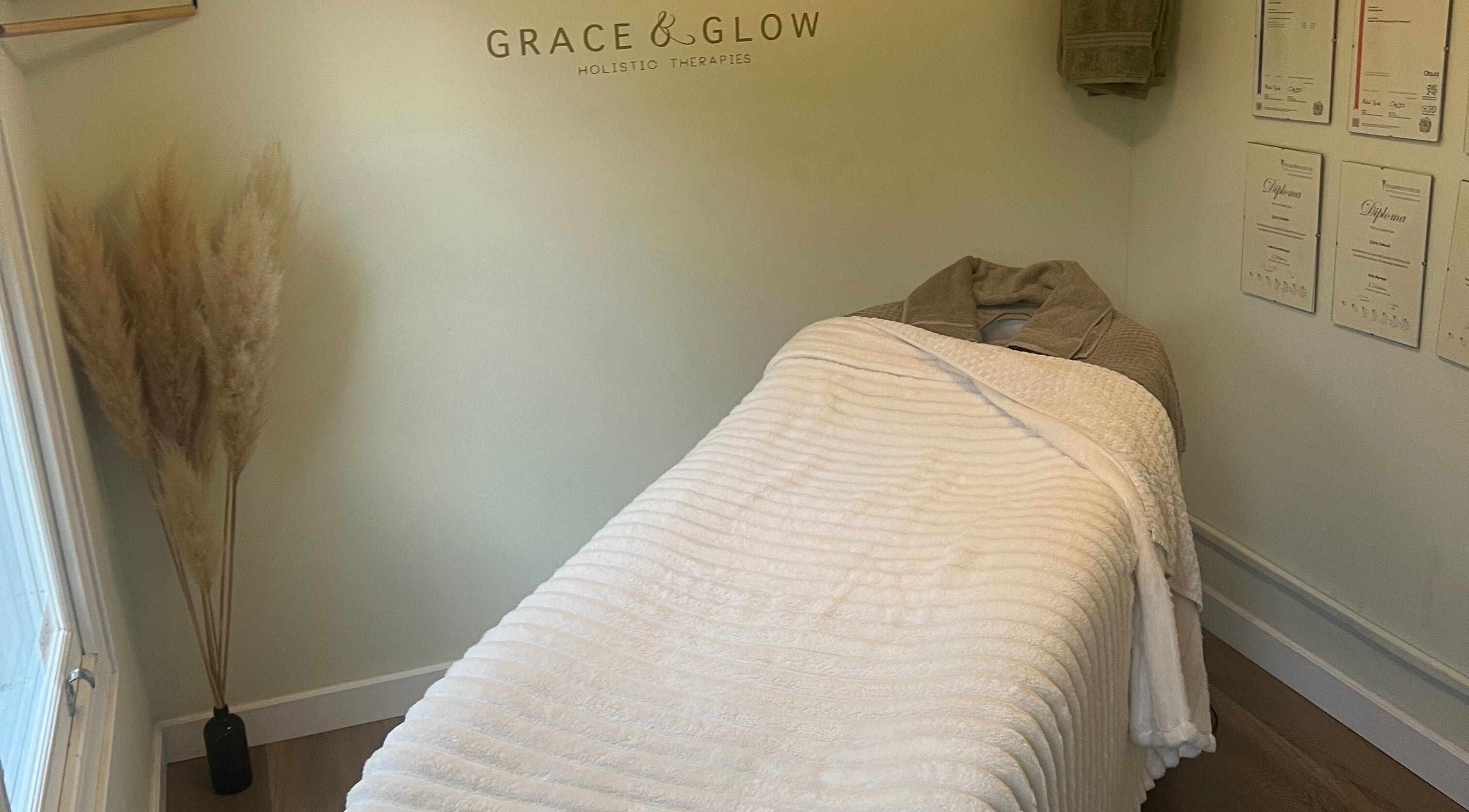 Cozy therapy room at Grace & Glow, Maidstone, England, GB, featuring a white massage table and soft decor.
