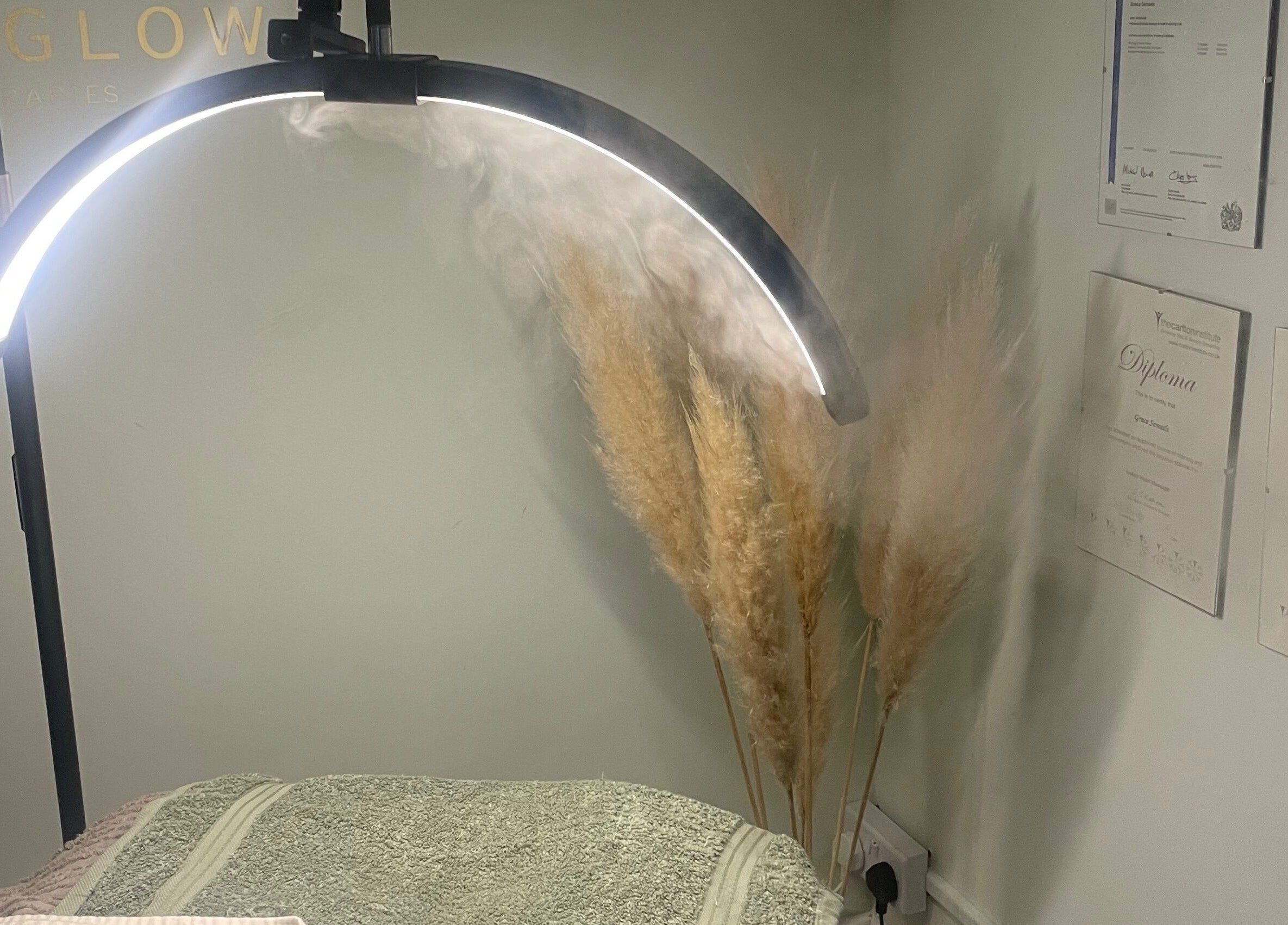 Grace & Glow therapy room with soft lighting, certificates, and decor in Maidstone, England, GB.