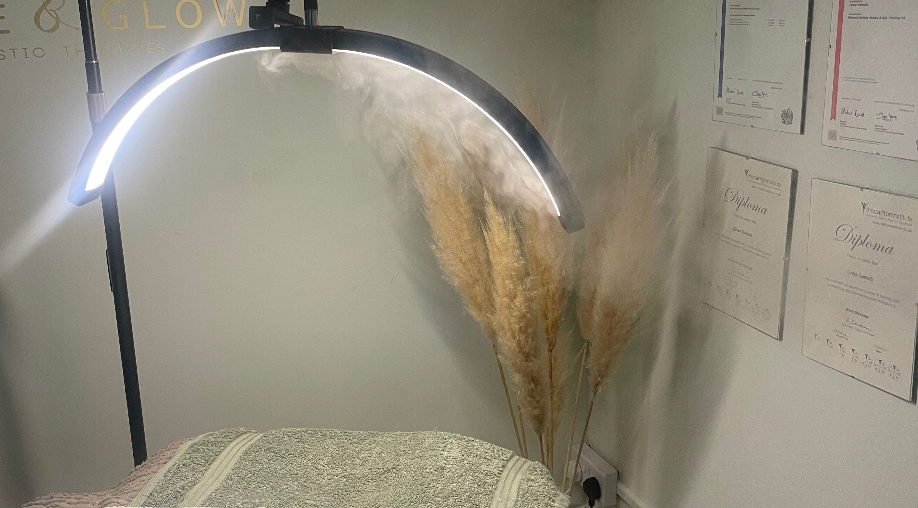 Grace & Glow therapy room with soft lighting, certificates, and decor in Maidstone, England, GB.