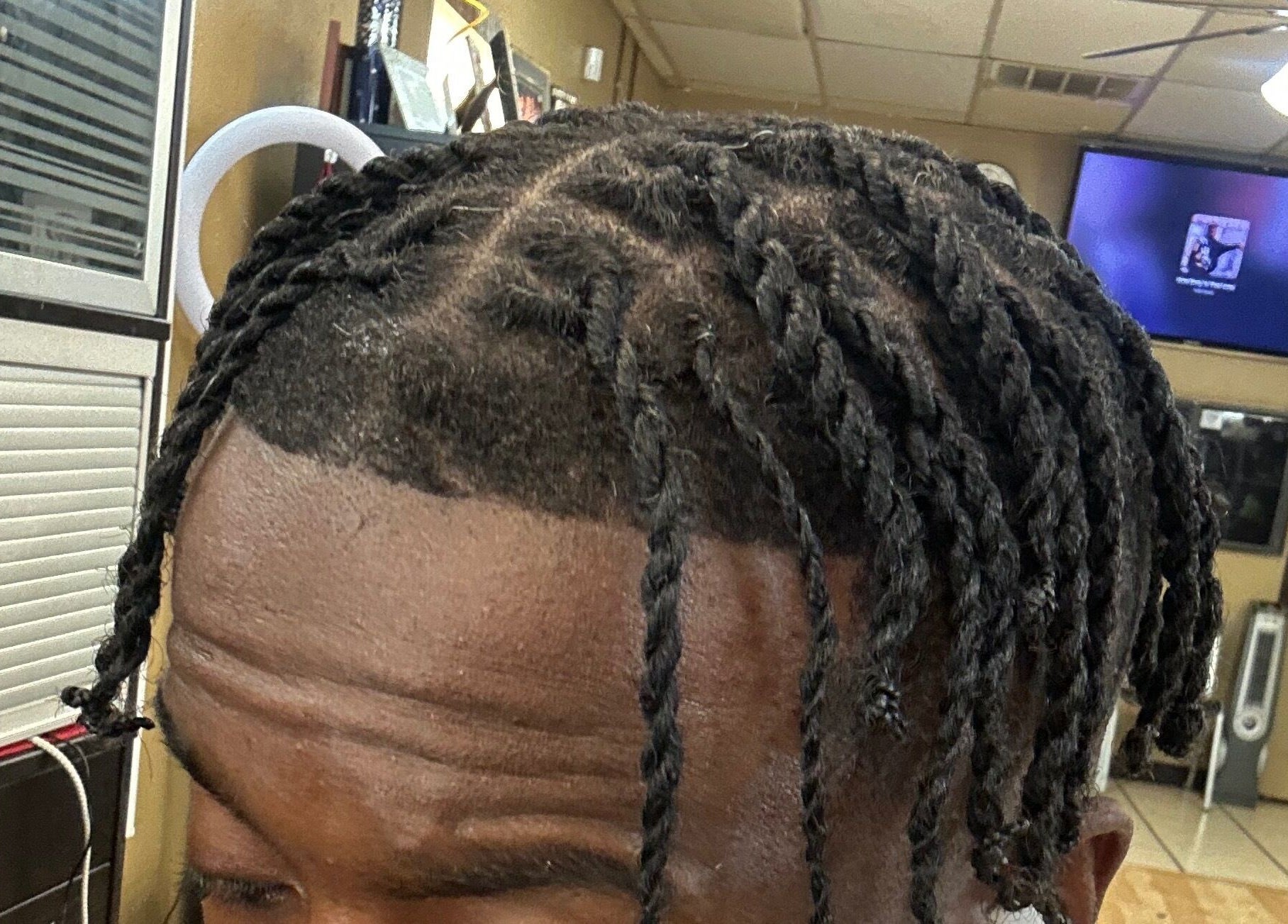 Close-up of intricate hair twists at Slayed By C Cimone in Houston, Texas, US, showcasing expert styling.