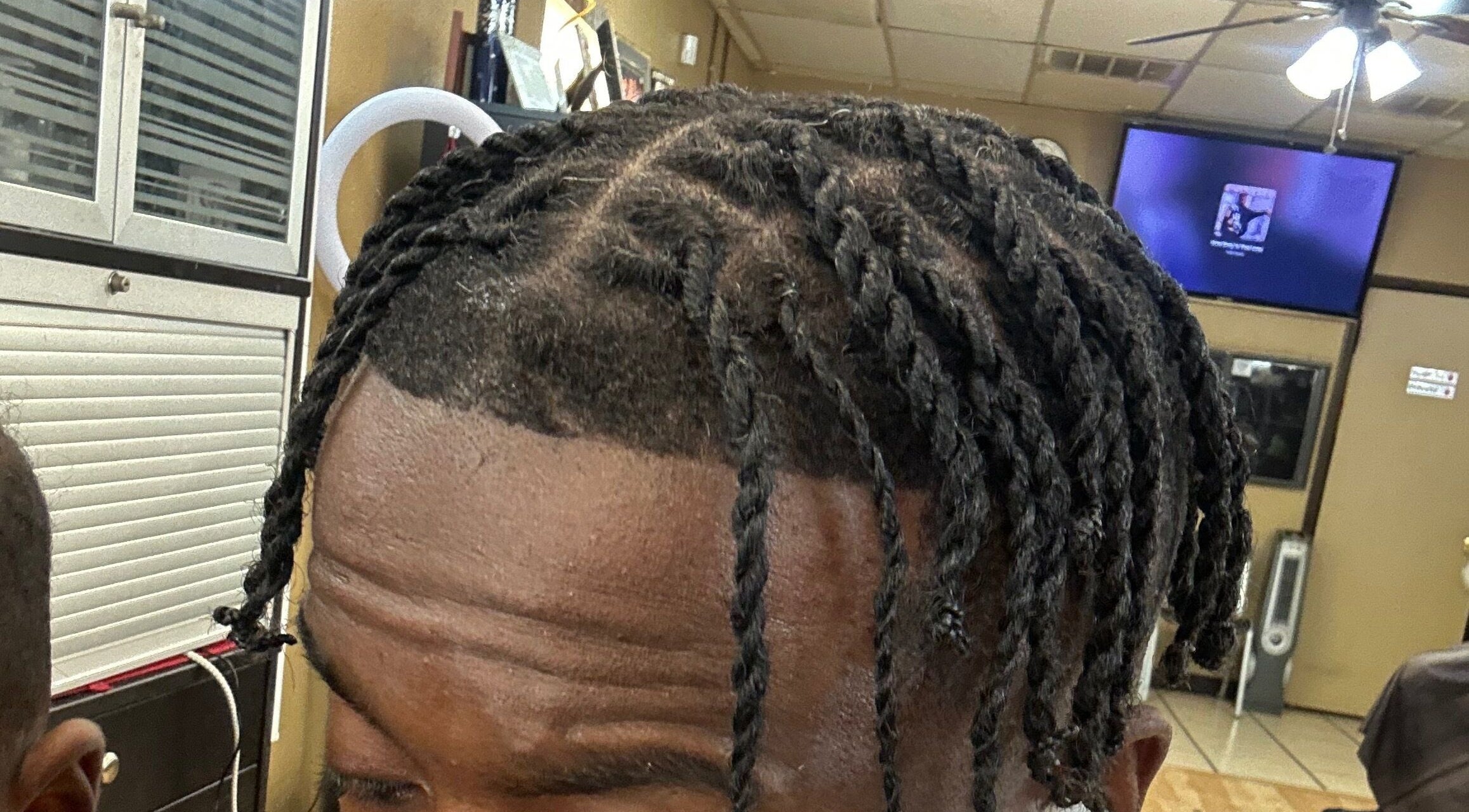 Close-up of intricate hair twists at Slayed By C Cimone in Houston, Texas, US, showcasing expert styling.