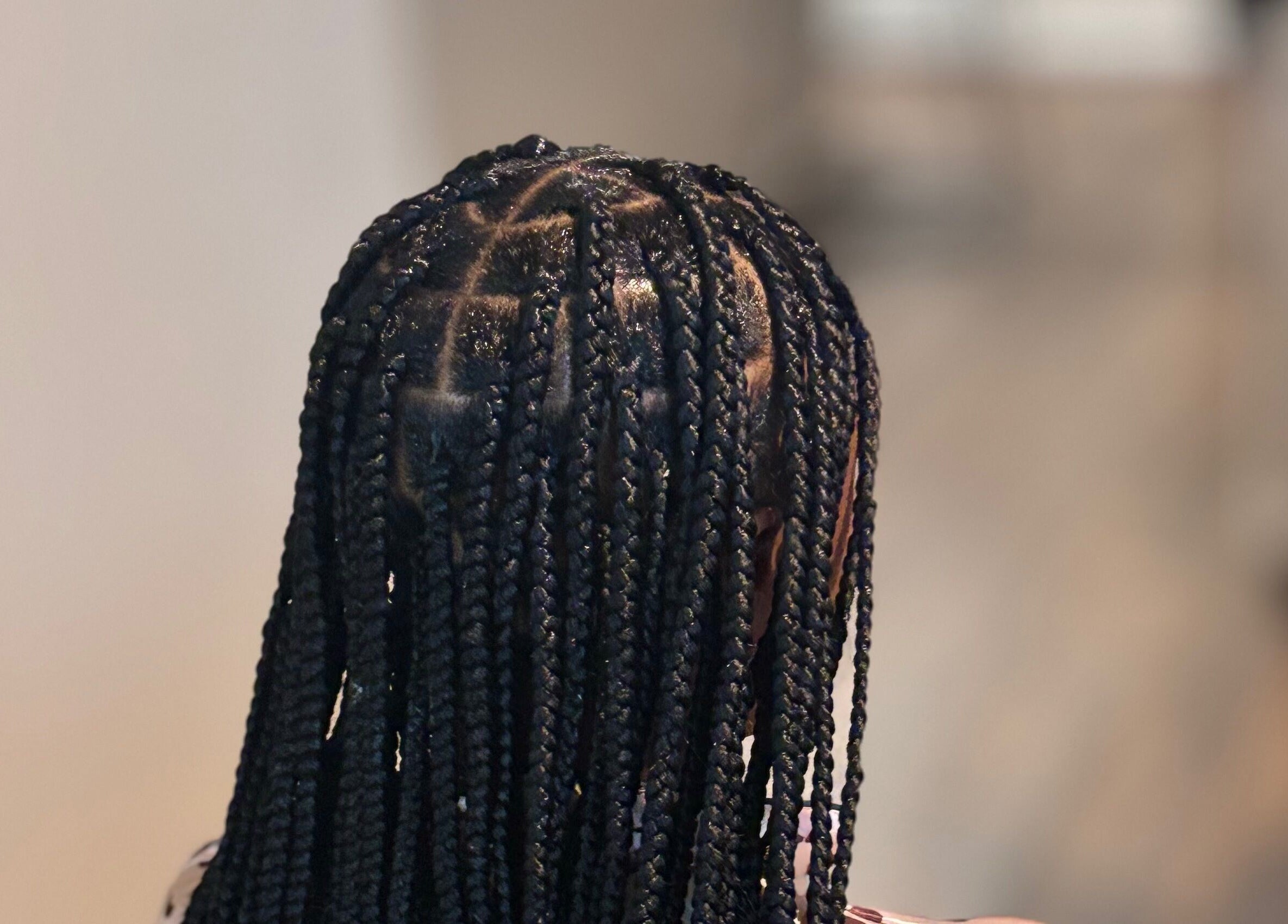 Intricate braids styled at Slayed By C Cimone in Houston, Texas, US, showcasing expert hair craftsmanship.