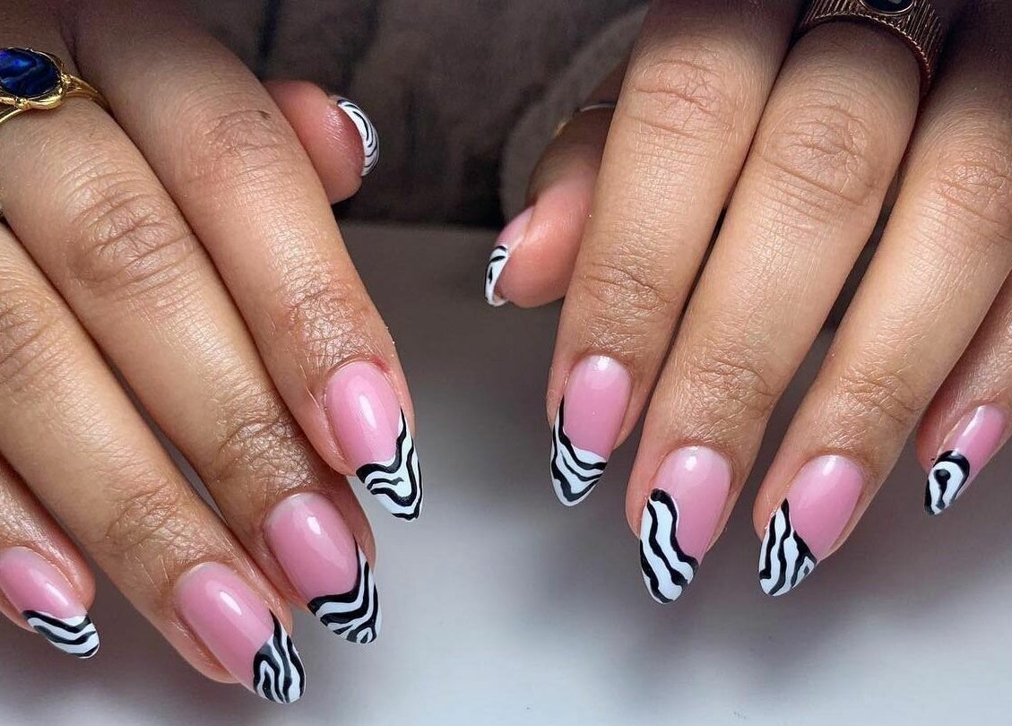 Unique zebra print nail art at FN Gel Bar, Rowley Regis, England, GB. Perfect for stylish nail design enthusiasts.