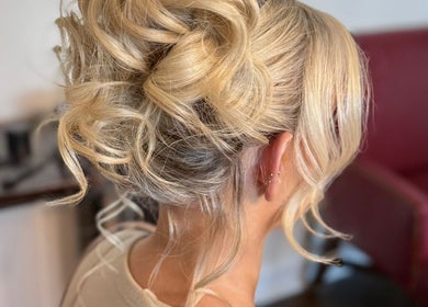 Blonde updo hairstyle at Gorgeous You Salon & Spa, Bridgeview, Illinois, US, highlighting expert styling.