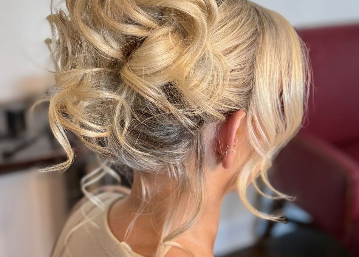 Blonde updo hairstyle at Gorgeous You Salon & Spa, Bridgeview, Illinois, US, highlighting expert styling.